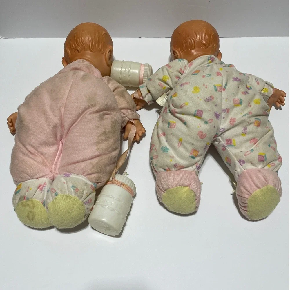 Vintage 1995 Toy Biz Gerber Baby Head Dolls Set of 2 with Bottles Blue Eyes Pink